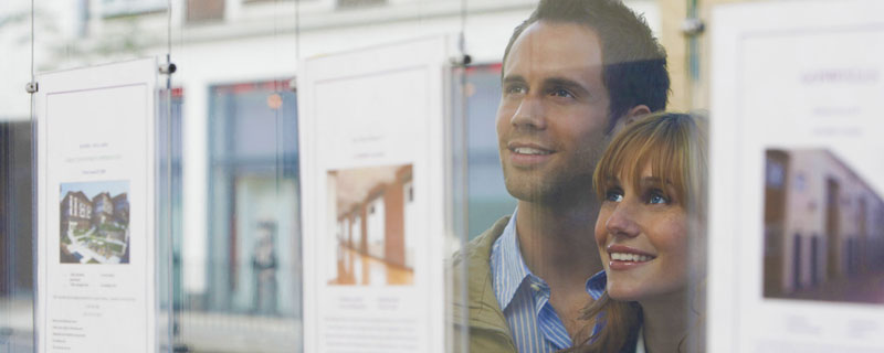 Couple looking at property listings